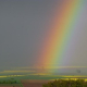 Regenbogen über Frühjahrslandschaft